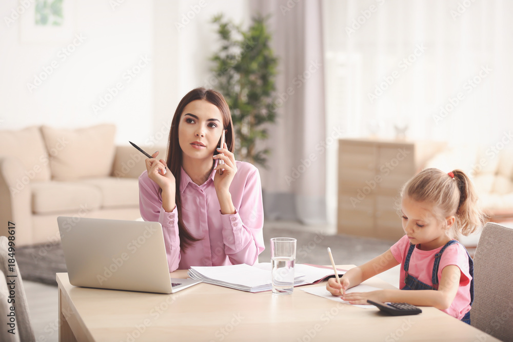 Poster busy young woman with daughter in home office