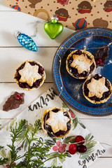 Mincemeat pies. Christmas decorations. Cranberries. White background.