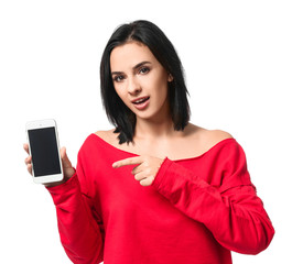 Naklejka premium Beautiful young woman with mobile phone on white background