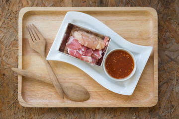 Slices of raw pork and chicken