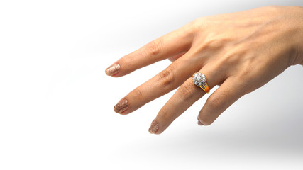 Woman hand with gold wedding ring.