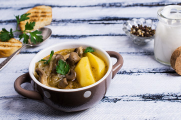 Transparent soup with oyster mushrooms