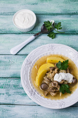 Transparent soup with oyster mushrooms