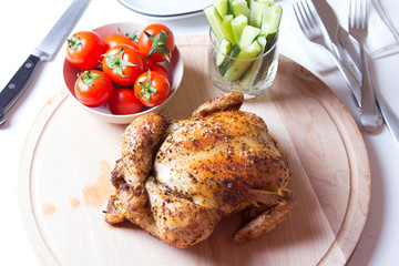 Chicken baked on salt. Selective focus, close-up.