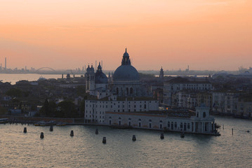 Obraz premium Punta della Dogana Gallery and Santa Maria della Salute сathedral on sunset. Venice