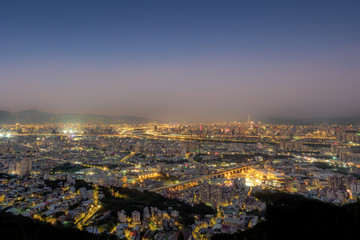 Aerial night view of Taipei City from Datongshan Mountain in Shulin, Taiwan.