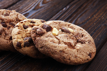 Chocolate cookies on wooden table. Chocolate chip cookies.