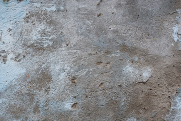 Wall fragment with scratches and cracks