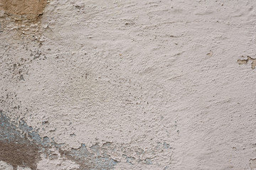 Wall fragment with scratches and cracks