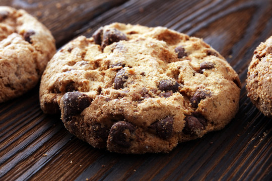 Chocolate cookies on wooden table. Chocolate chip cookies.