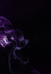 Purple smoke on black background