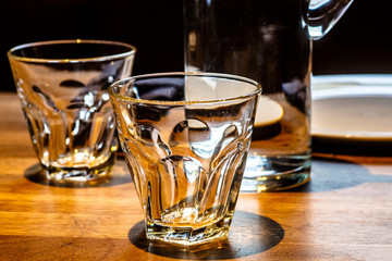 A carafe of water and glasses are on the table