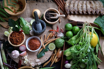 Assortment of Thai food Cooking ingredients. Spices ingredients chilli pepper garlicgalanga and kaffir lime leaves.