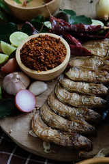 Assortment of Thai food Cooking ingredients. Spices ingredients chilli pepper garlicgalanga and kaffir lime leaves.