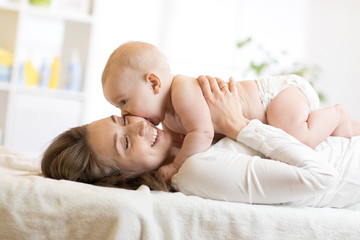 Adorable baby kissing his mother - Powered by Adobe