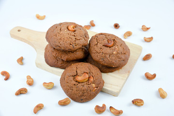 Cashews cookies on wooden board.