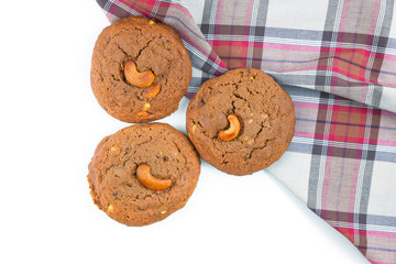 Cookie isolated on brown cloth and white background.