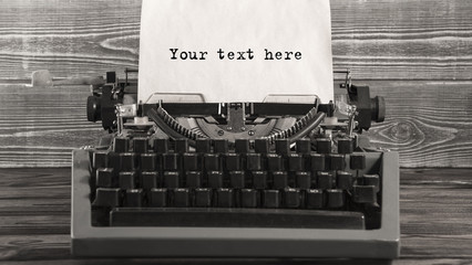 Your text here words on a Vintage Typewriter. Mechanisms closeup. Typing on old typewriter.