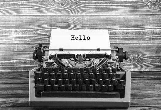 Hello words on a Vintage Typewriter. Mechanisms closeup. Typing on old typewriter. Doodle style antique manual typewriter.