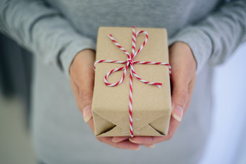 Closed up of woman hands with gift box
