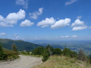 Fototapeta na wymiar a panorama of a cloudy blue sky above the Ukrainian Carpathians.