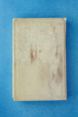 old book on a blue background. Place for inscription