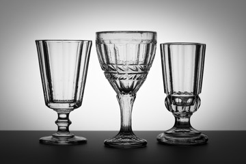 Vintage glasses for alcoholic beverages. Studio photography.