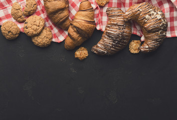 Homemade french croissants and cookies on wood