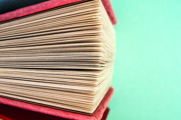 Top view of bright colorful hardback books in a circle.