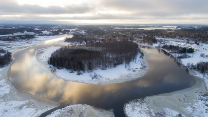 Aerial view of the village and river at winter. Sunset time, Lempaala