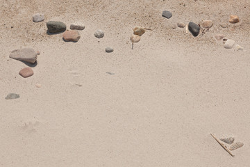 Fototapeta na wymiar Sand and beach stones background