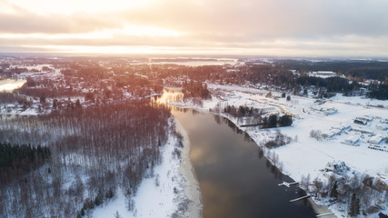 Aerial view of the village and river at sunset. Winter  season. Lempaala