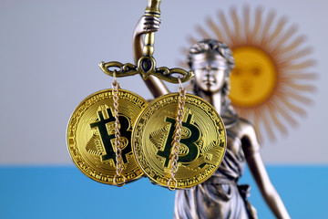 Symbol of law and justice, physical version of Bitcoin and Argentina Flag. Prohibition of...