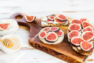 Healthy crackers and toast with figs and ricotta cheese