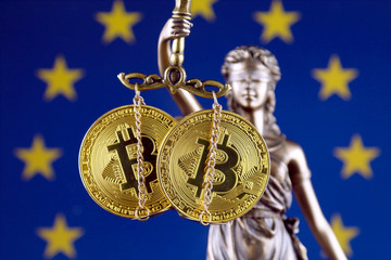 Symbol of law and justice, physical version of Bitcoin and European Union Flag. Prohibition of...