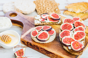 Healthy crackers and toast with figs and ricotta cheese