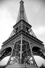 A view of the Eiffel Tower in black and white.