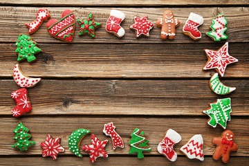 Christmas gingerbread cookies on brown wooden table