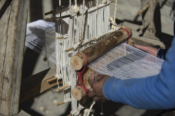 woman weaver in Nepal, the city of Manang. Mustang, Himalayas, December 2017