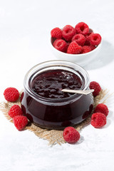 raspberry jam in a glass jar, vertical