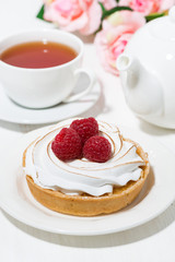 sweet tartlet with meringue and raspberry, vertical top view