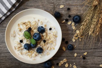 Overnight Oats with banana and blueberries overhead view / Healthy breakfast