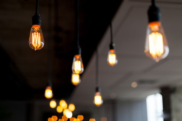 Bokeh of Bright Antique Lamps Light Bulb Hang on Ceiling © athurfotolia