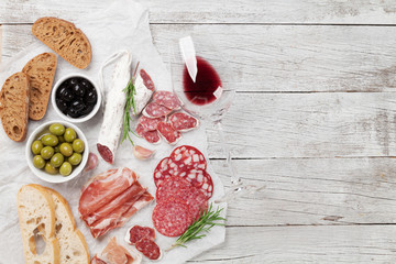 Salami, ham, sausage, prosciutto and wine