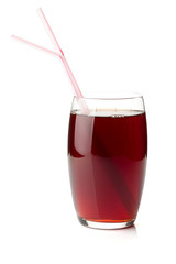 Pomegranate juice in a glass with two drinking straws