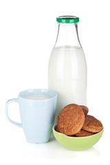 Cup, bottle of milk and cookies