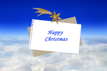 Kartka Happy Christmas nad chmurami i błąkitnym niebem. - obrazy, fototapety, plakaty