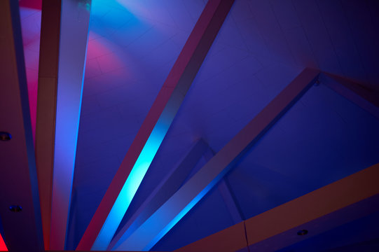 Abstraction. Beams under Polycom with coloured lights. Beautiful rich colors