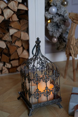 Romantic atmosphere. Warm the house. Cage with candles. Calm