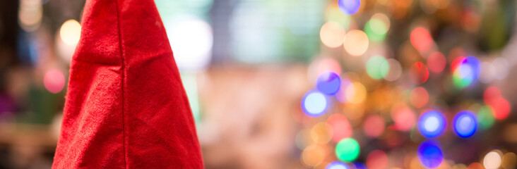 Santa hat and bokeh light Christmas tree, happy new year, copy space.